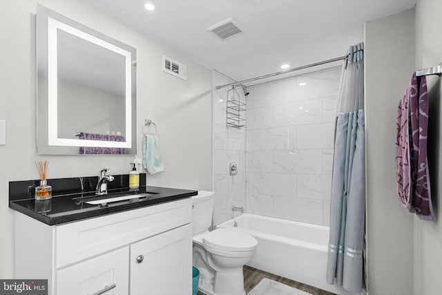 10412 Midway Ln, Lorton, VA 22079 - bathroom featuring recessed lighting, wood finished floors, vanity, shower / tub combo, and toilet