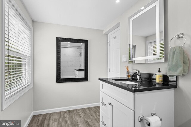 10412 Midway Ln, Lorton, VA 22079 - full bath featuring wood finished floors, baseboards, vanity, recessed lighting, and a shower