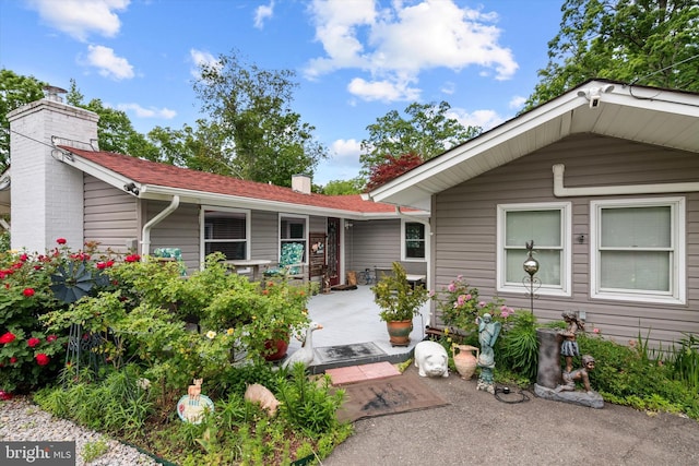 10412 Midway Ln, Lorton, VA 22079 - view of front of property with a chimney and covered porch