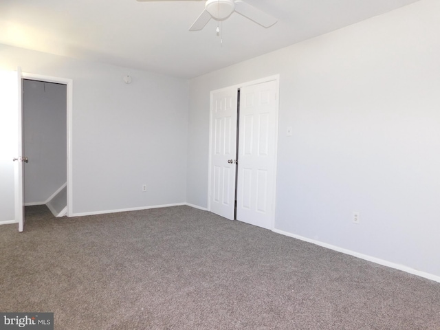 unfurnished bedroom featuring carpet, baseboards, and a ceiling fan