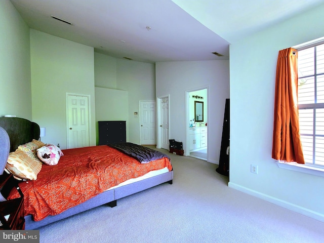 29 Ferns Ct, Lutherville Timonium, MD 21093 - bedroom with carpet flooring, baseboards, multiple windows, high vaulted ceiling, and ensuite bath