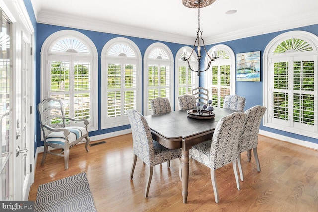 8170 Hollow Rd, Middletown, MD 21769 - dining room featuring light wood-style floors, crown molding, and baseboards