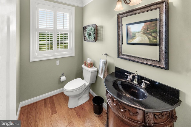 8170 Hollow Rd, Middletown, MD 21769 - bathroom with baseboards, wood finished floors, vanity, toilet, and ornamental molding