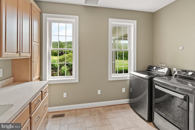 8170 Hollow Rd, Middletown, MD 21769 - washroom featuring washing machine and clothes dryer, cabinet space, plenty of natural light, and baseboards