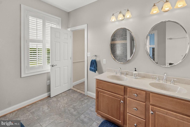 8170 Hollow Rd, Middletown, MD 21769 - bathroom with double vanity and baseboards