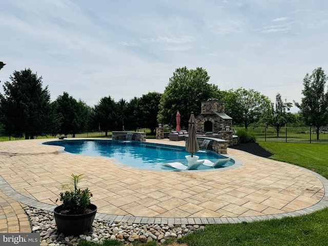 8170 Hollow Rd, Middletown, MD 21769 - outdoor pool with an outdoor stone fireplace and a patio