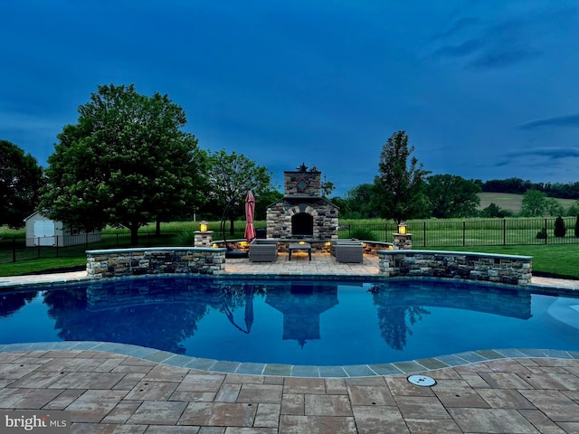 8170 Hollow Rd, Middletown, MD 21769 - view of swimming pool with an outdoor stone fireplace and a patio area