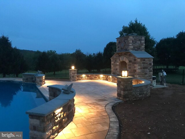 8170 Hollow Rd, Middletown, MD 21769 - view of patio featuring exterior fireplace