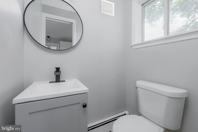 127 N Broad St, Penns Grove, NJ 08069 - bathroom with a baseboard radiator, toilet, and vanity