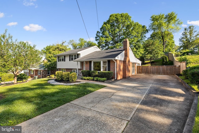 7900 Foote Ln, Springfield, VA 22151 - tri-level home featuring brick siding, driveway, and a chimney