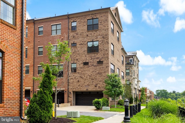 501 Triggerfish Dr, Oxon Hill, MD 20745 - view of building exterior featuring an attached garage and driveway