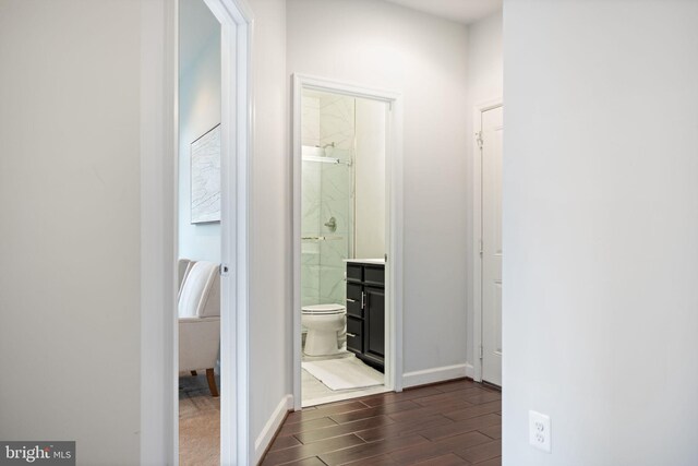 501 Triggerfish Dr, Oxon Hill, MD 20745 - hallway featuring dark wood-style flooring and baseboards