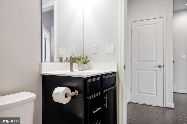 501 Triggerfish Dr, Oxon Hill, MD 20745 - bathroom with vanity, wood finished floors, and toilet