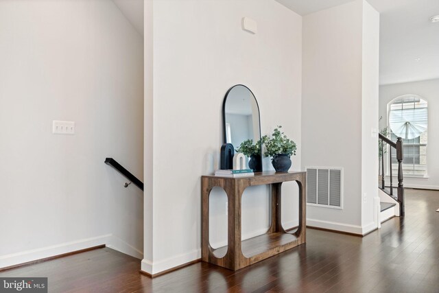 501 Triggerfish Dr, Oxon Hill, MD 20745 - hallway featuring wood finished floors, baseboards, and an upstairs landing
