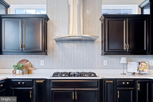 501 Triggerfish Dr, Oxon Hill, MD 20745 - kitchen featuring wall chimney exhaust hood, gas stovetop, light countertops, and tasteful backsplash