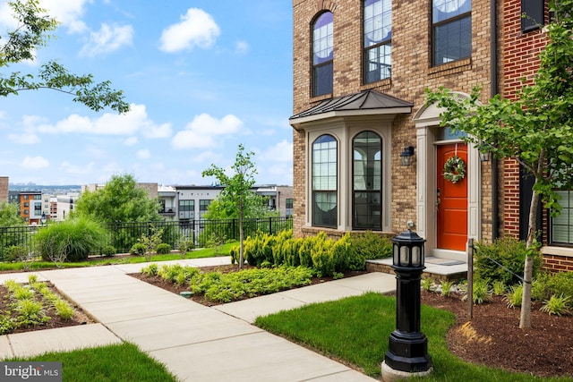 501 Triggerfish Dr, Oxon Hill, MD 20745 - entrance to property featuring brick siding, a standing seam roof, and metal roof