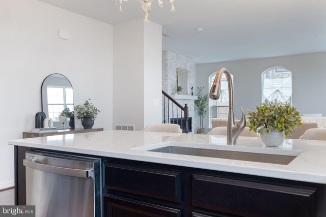 501 Triggerfish Dr, Oxon Hill, MD 20745 - kitchen with dishwasher, a sink, open floor plan, and light stone counters
