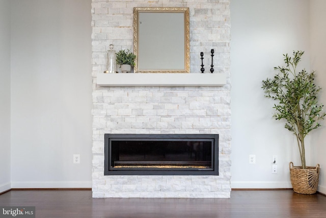 501 Triggerfish Dr, Oxon Hill, MD 20745 - detailed view of a stone fireplace, wood finished floors, and baseboards
