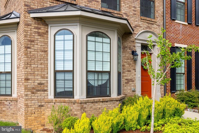 501 Triggerfish Dr, Oxon Hill, MD 20745 - entrance to property featuring brick siding and a standing seam roof