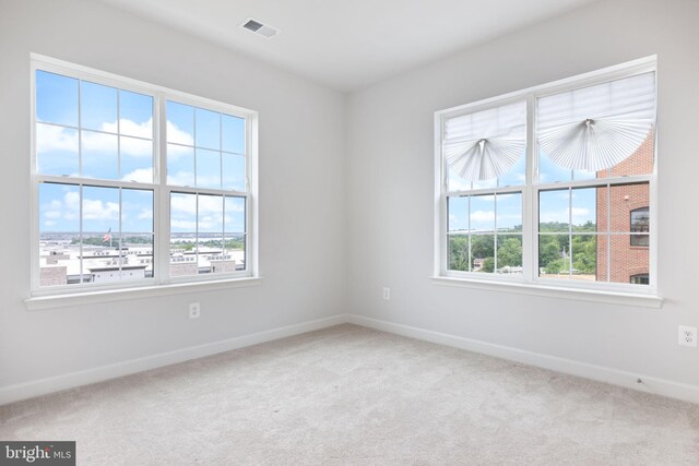 501 Triggerfish Dr, Oxon Hill, MD 20745 - carpeted empty room featuring plenty of natural light and baseboards