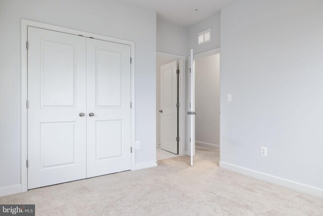 501 Triggerfish Dr, Oxon Hill, MD 20745 - unfurnished bedroom featuring a closet, carpet floors, and baseboards
