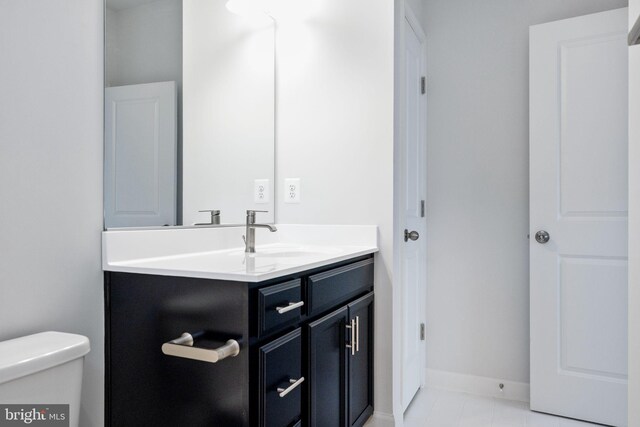 501 Triggerfish Dr, Oxon Hill, MD 20745 - half bath featuring vanity, toilet, and baseboards