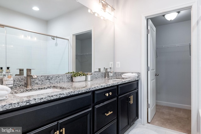501 Triggerfish Dr, Oxon Hill, MD 20745 - full bath with double vanity, a walk in closet, and a tile shower