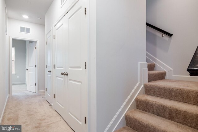 501 Triggerfish Dr, Oxon Hill, MD 20745 - hall featuring light carpet, stairway, baseboards, and recessed lighting