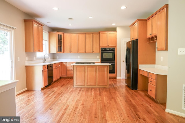 720 Beehive Way, Winchester, VA 22601 - kitchen featuring black appliances, light brown cabinets, light wood-style floors, light countertops, and recessed lighting