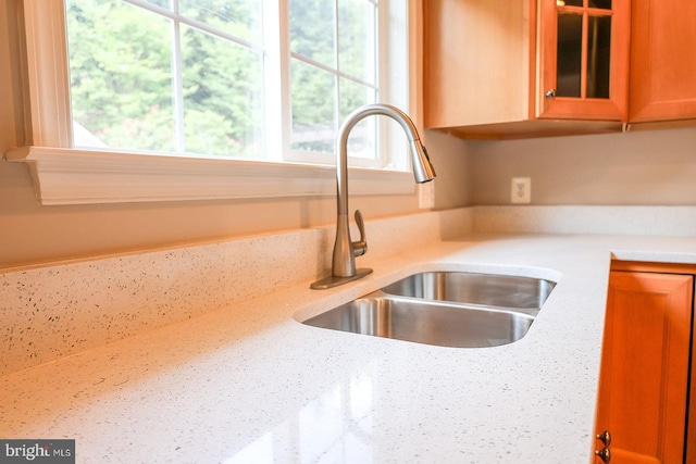 720 Beehive Way, Winchester, VA 22601 - kitchen featuring a sink, glass insert cabinets, light countertops, and brown cabinetry