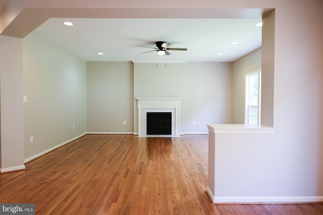 720 Beehive Way, Winchester, VA 22601 - unfurnished living room featuring ceiling fan, light wood-style flooring, a fireplace with flush hearth, baseboards, and recessed lighting