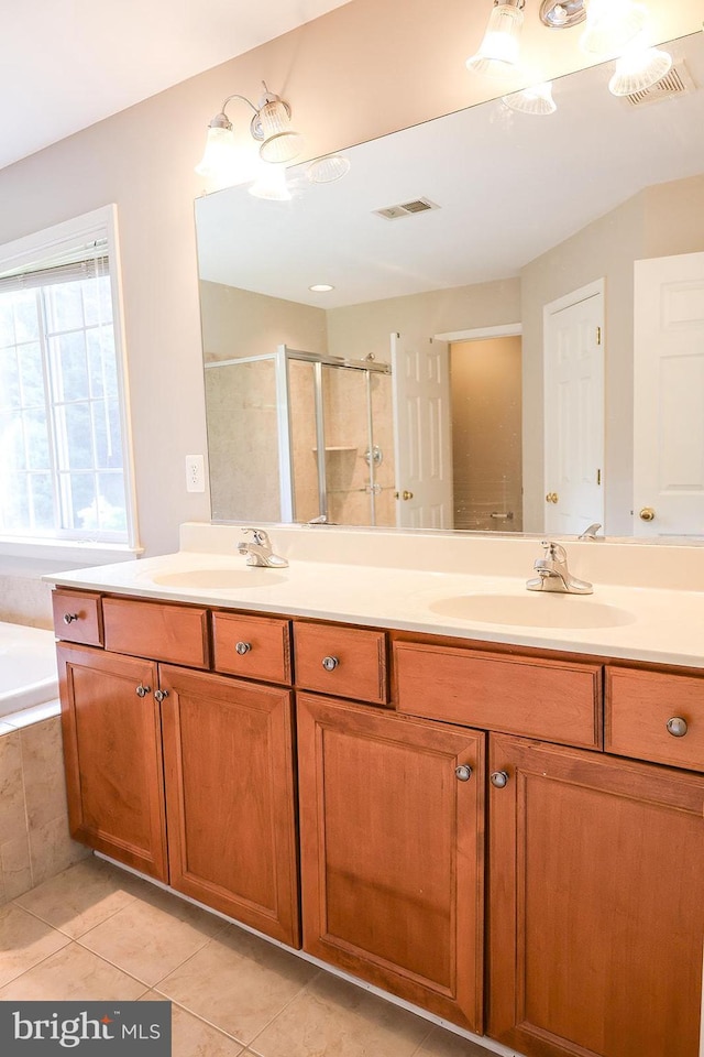 720 Beehive Way, Winchester, VA 22601 - full bathroom with a stall shower, tile patterned flooring, double vanity, and a bath