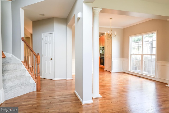 720 Beehive Way, Winchester, VA 22601 - corridor featuring light wood-type flooring, a chandelier, wainscoting, stairway, and ornate columns