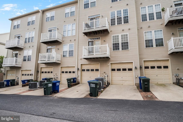 7269 Elkridge Crossing Way, Elkridge, MD 21075 - view of building exterior with central AC unit, a garage, and driveway