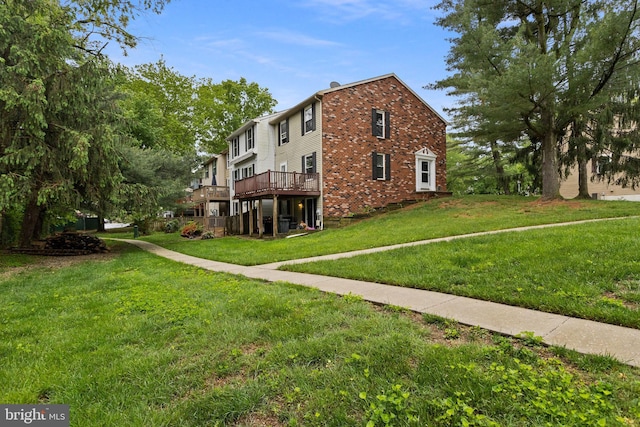7 Woodland Ct, Hamilton, NJ 08610 - view of property exterior featuring a wooden deck, a lawn, and brick siding