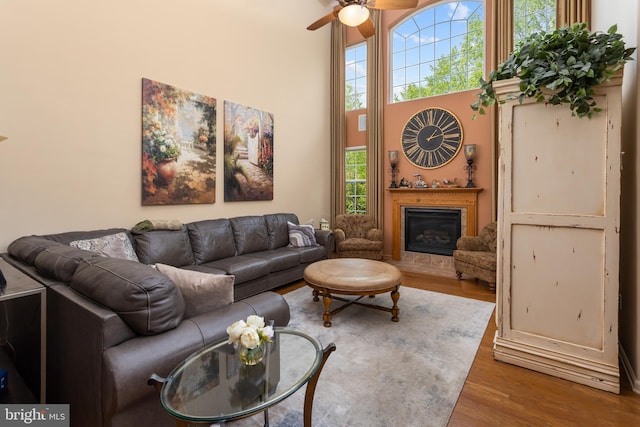 29 Monte Carlo Dr, Hamilton, NJ 08691 - living area with ceiling fan, wood finished floors, a high ceiling, and a glass covered fireplace