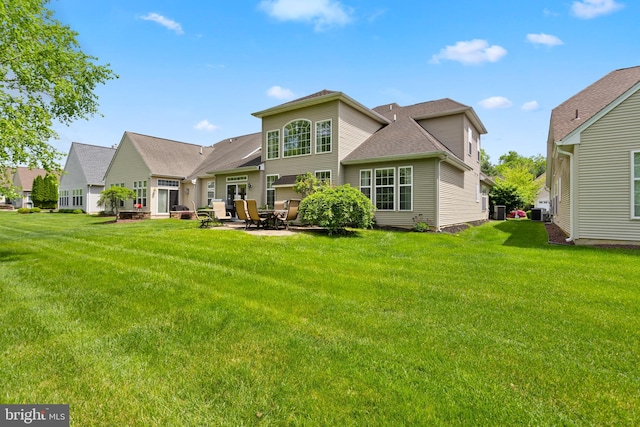 29 Monte Carlo Dr, Hamilton, NJ 08691 - rear view of house featuring a lawn and a patio area