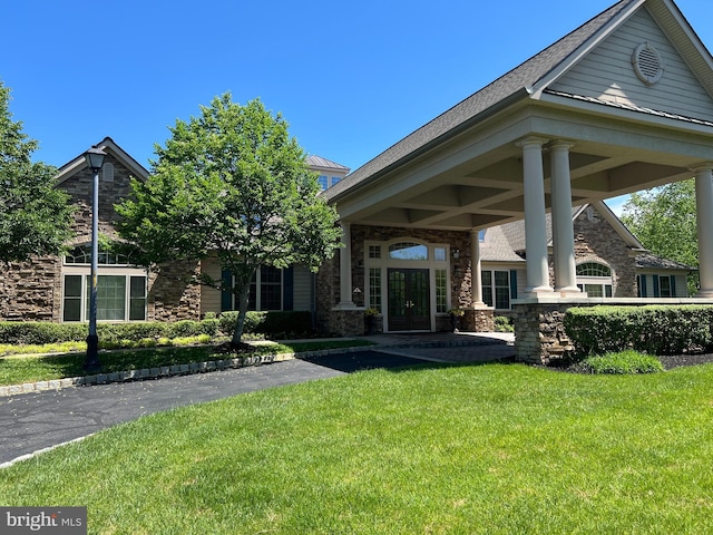 29 Monte Carlo Dr, Hamilton, NJ 08691 - rear view of house with french doors, stone siding, and a lawn