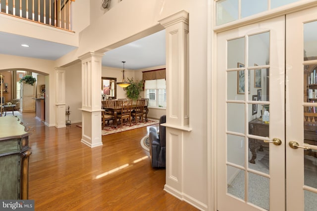 29 Monte Carlo Dr, Hamilton, NJ 08691 - entrance foyer featuring decorative columns, dark wood finished floors, arched walkways, baseboards, and french doors