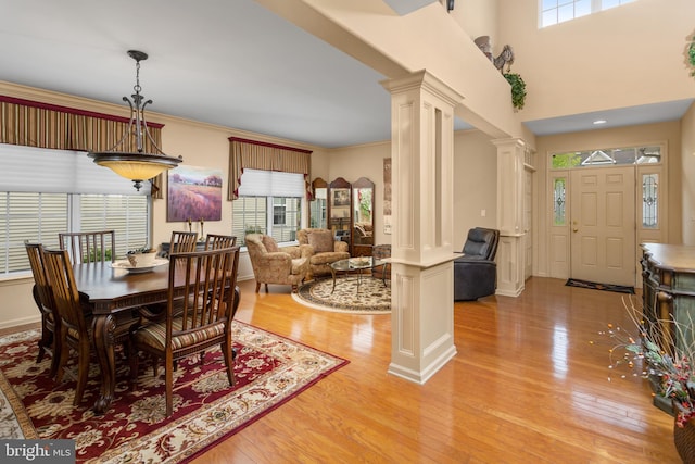 29 Monte Carlo Dr, Hamilton, NJ 08691 - dining area featuring decorative columns, healthy amount of natural light, and light wood-style floors