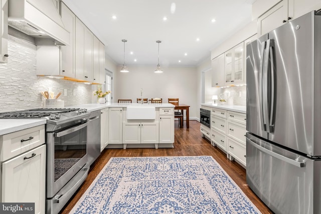 255 Lower Magothy Beach Rd, Severna Park, MD 21146 - kitchen with stainless steel appliances, a sink, a peninsula, backsplash, and custom range hood