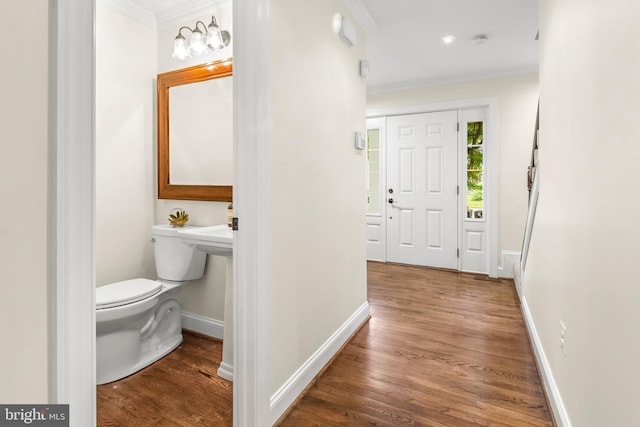 255 Lower Magothy Beach Rd, Severna Park, MD 21146 - bathroom featuring toilet, ornamental molding, wood finished floors, and baseboards