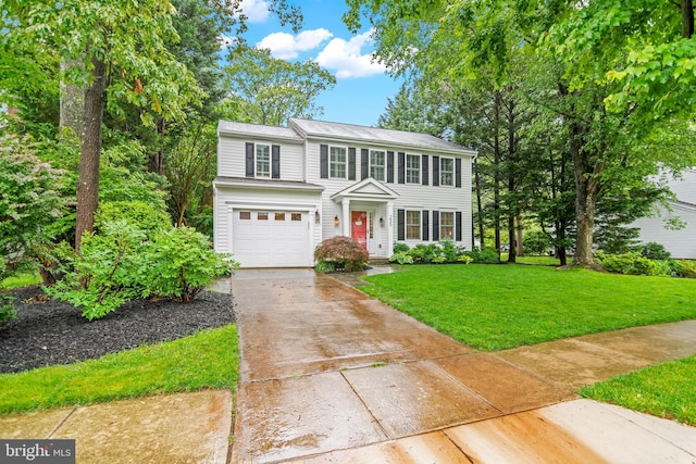 255 Lower Magothy Beach Rd, Severna Park, MD 21146 - view of front of home featuring concrete driveway, a garage, and a front lawn