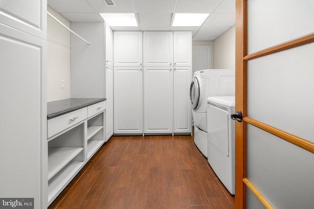 255 Lower Magothy Beach Rd, Severna Park, MD 21146 - laundry room featuring washer and dryer, cabinet space, and dark wood-style flooring