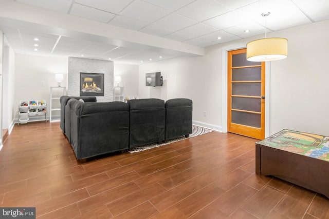 255 Lower Magothy Beach Rd, Severna Park, MD 21146 - living room with a paneled ceiling, baseboards, wood finished floors, a fireplace, and recessed lighting