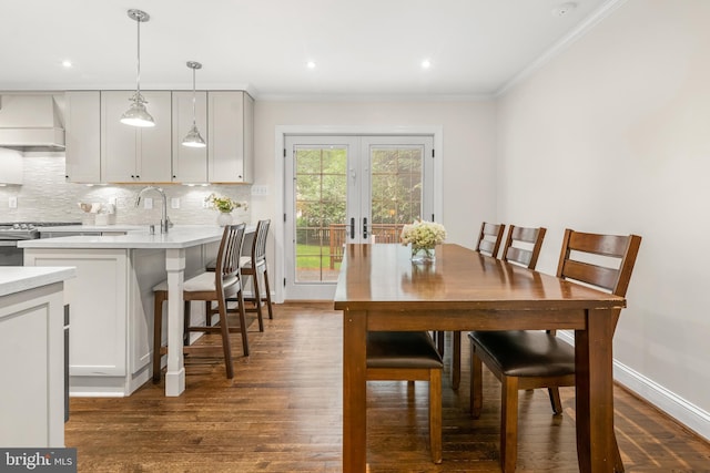 255 Lower Magothy Beach Rd, Severna Park, MD 21146 - dining area featuring ornamental molding, dark wood-type flooring, baseboards, and recessed lighting