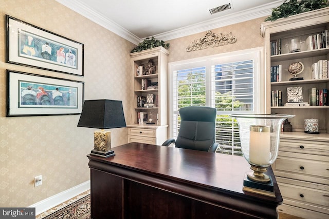 home office with wallpapered walls, ornamental molding, and baseboards