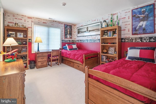 carpeted bedroom with wallpapered walls