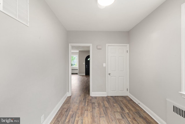 2811 Westfield Ave, Baltimore, MD 21214 - hallway featuring wood finished floors and radiator heating unit
