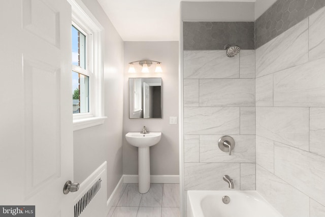 2811 Westfield Ave, Baltimore, MD 21214 - full bath with marble look tiles and bathing tub / shower combination